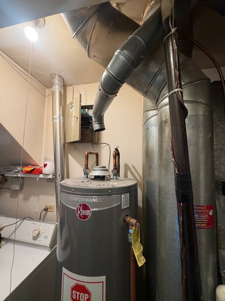 Newly installed Bradford White gas water heater in a basement